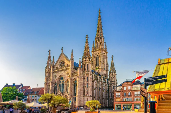 Une vue aérienne ou une photographie de la ville de Mulhouse montrant son centre-ville avec son architecture caractéristique alsacienne (bâtiments historiques, rues) en jour clair, évoquant une ville dynamique du Territoire de Belfort. La qualité doit être celle d'une photo professionnelle de paysage urbain.